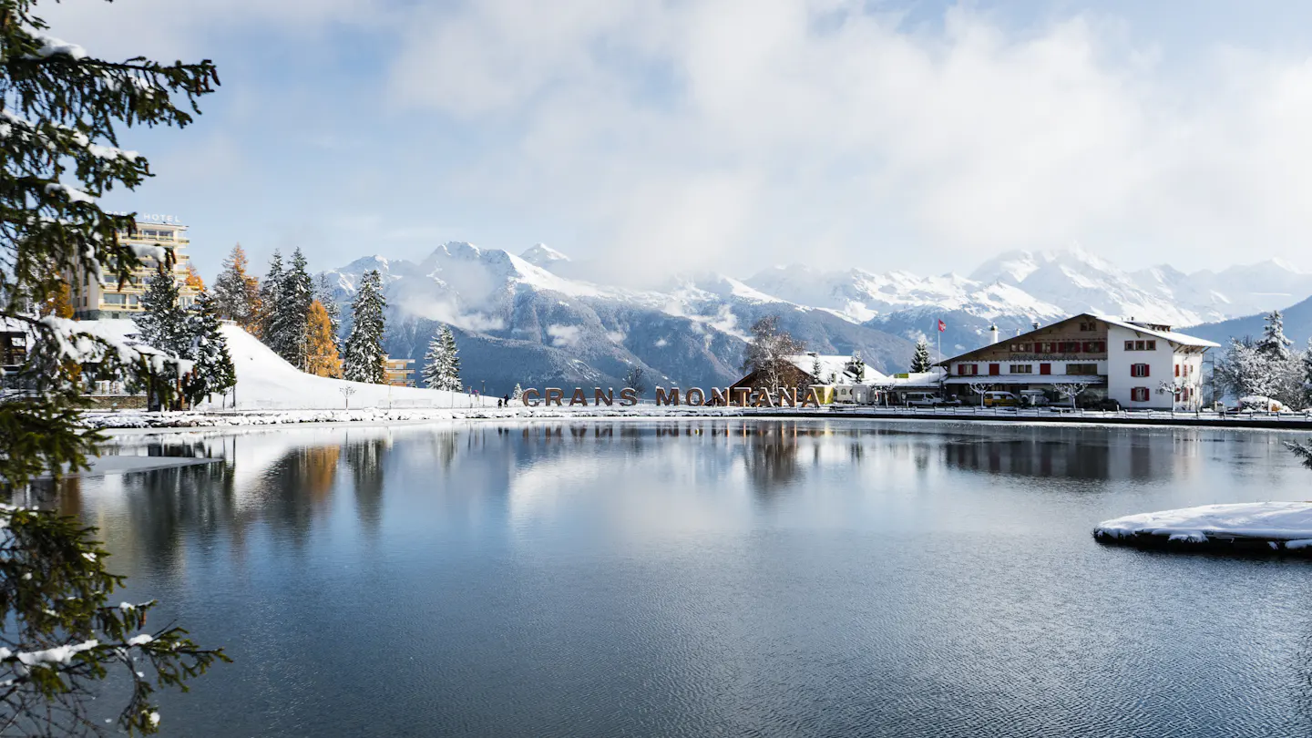 Lake and snowy mountains at Crans-Montana
