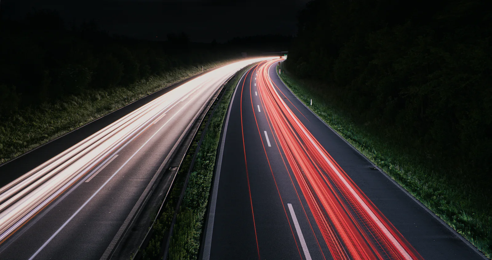 Light trails of cars on a motorway at night