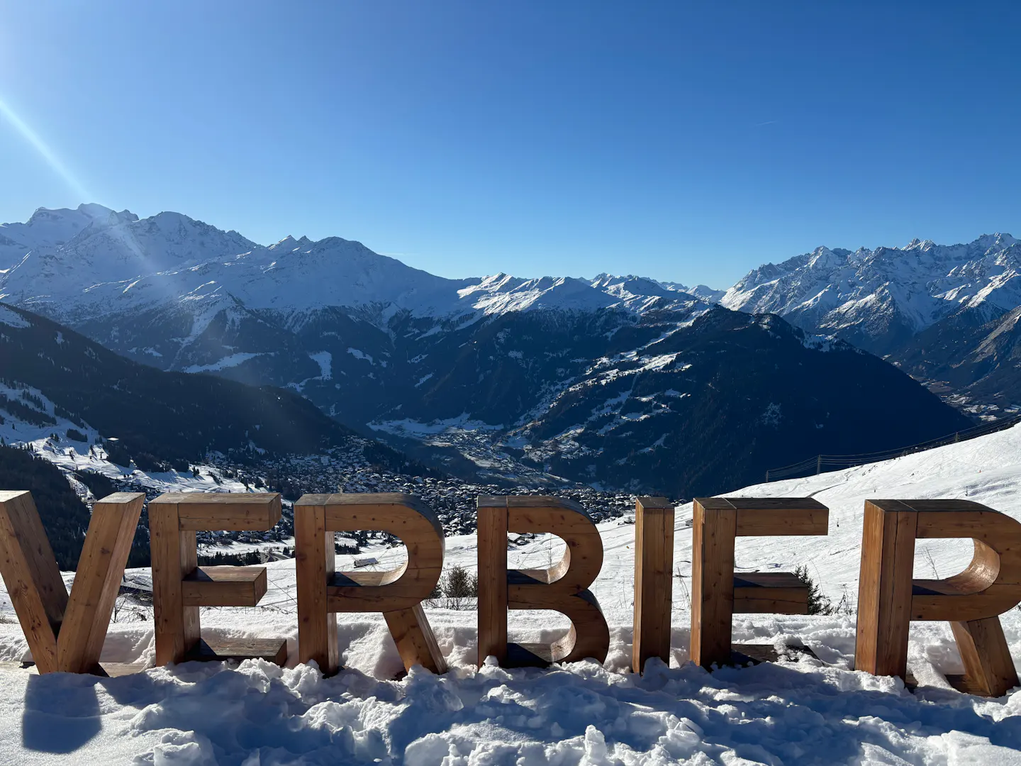 Verbier sign with the snowy Valais mountains